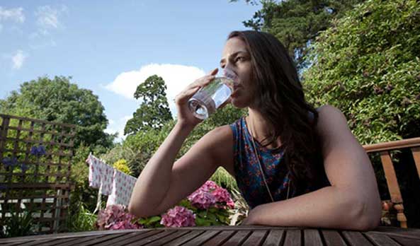 Having a glass of water