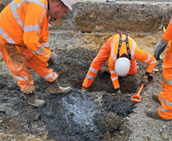 An image of a team at the site of a burst sewer in St Leonards